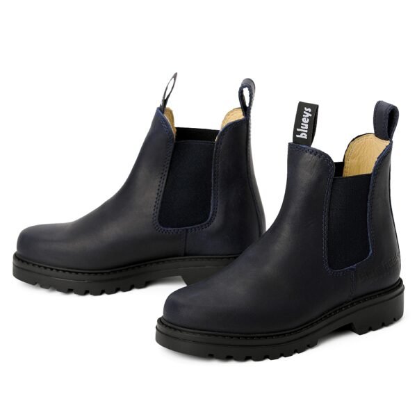 Navy blue Chelsea boots for men shown in a front angled pair view with black outsoles and elastic side panels.